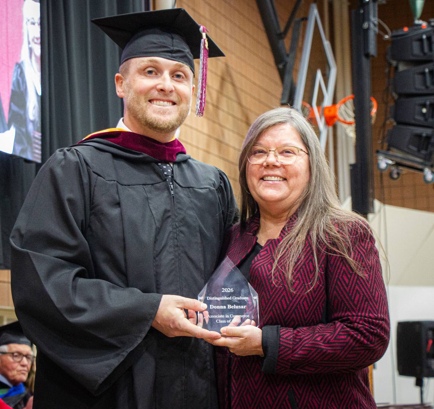 Donna Belusar receives the Distinguished Graduate award